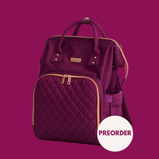 A deep purple quilted backpack with gold-tone hardware and trim, shown on a solid magenta background with a white 'PREORDER' badge in the lower right corner.