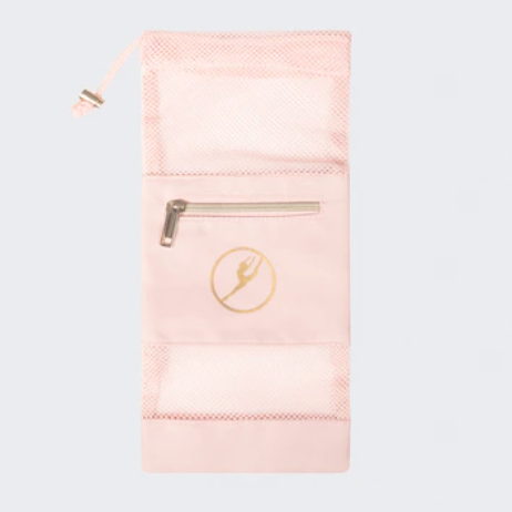Pink pouch with a gold zipper and logo on a light gray background