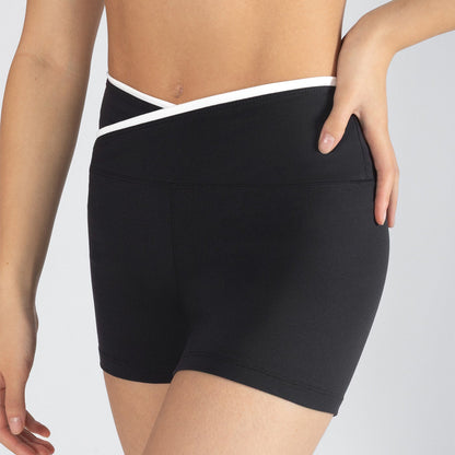 Black athletic shorts with white waistband on a gray background