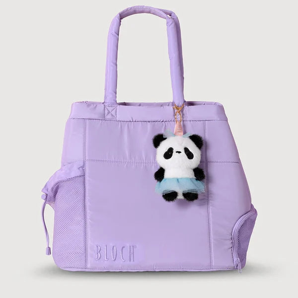 A light purple/lavender BLOOM tote bag with dual top handles, a side drawstring pocket, and a small panda plush keychain hanging from the zipper, shown on a solid light gray background.