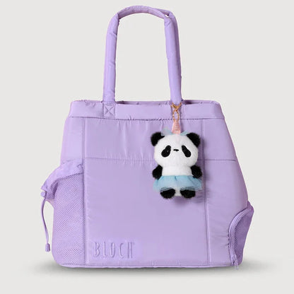 A light purple/lavender BLOOM tote bag with dual top handles, a side drawstring pocket, and a small panda plush keychain hanging from the zipper, shown on a solid light gray background.
