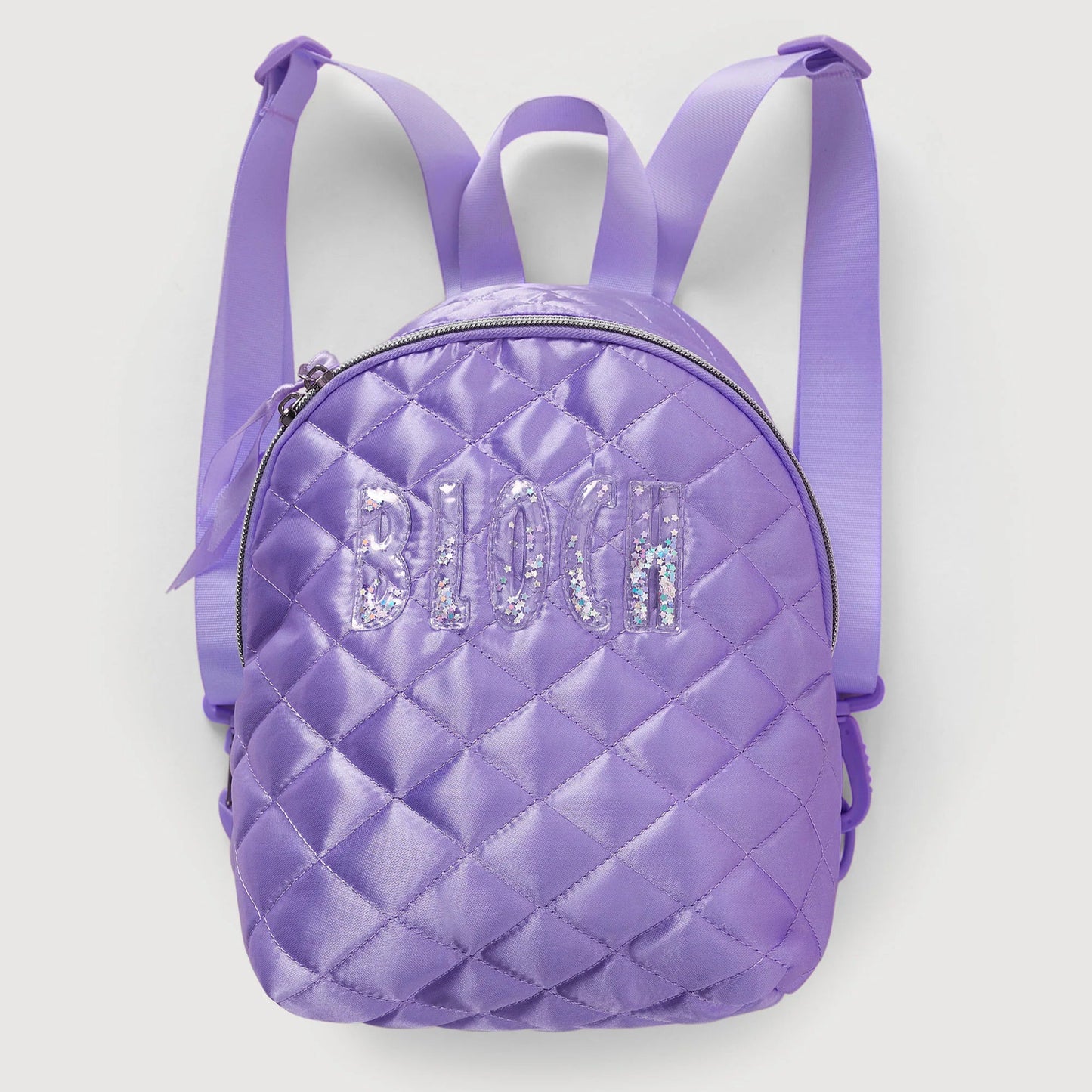 Purple quilted backpack with 'Bloch' branding on a light gray background